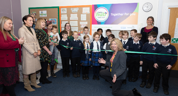 Children from Ash Grove Academy in Macclesfield help to cut the ribbon at the opening of Ash Grove family hub