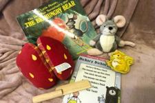 picture of the book with the props for the story 
