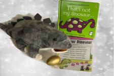 picture of the book and the dinosaur toy 