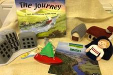 a picture of the book with the props that accompany the story.