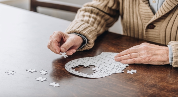 Dementia elderly man brain jigsaw 570x310