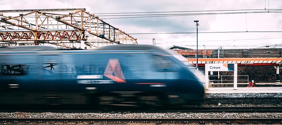 A train travelling fast through a station