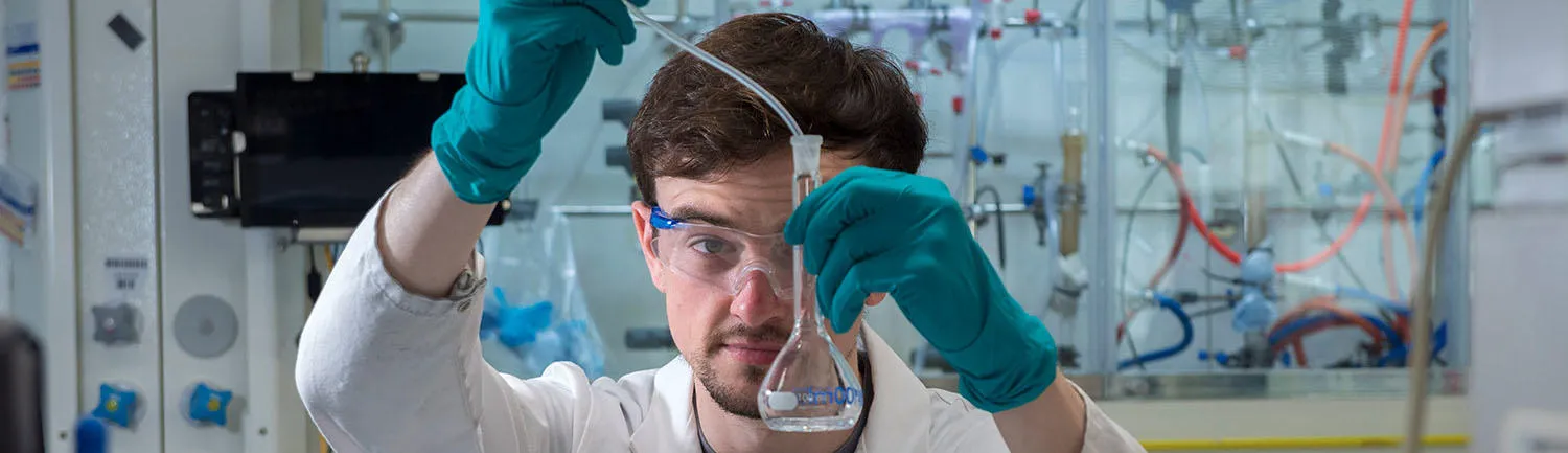 A man working in a laboratory (Astra Zeneca) 1500x433