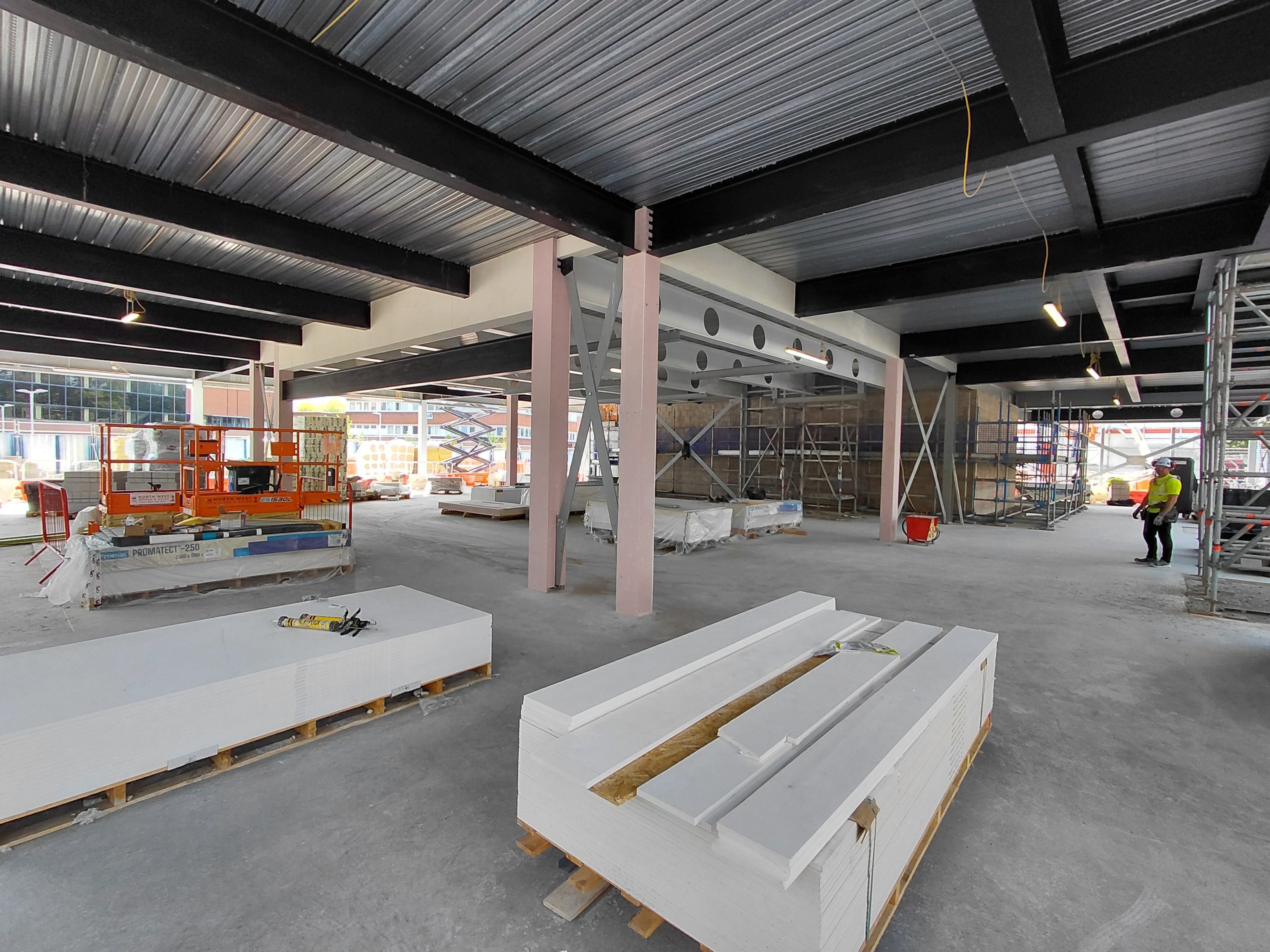 Construction site of the new Cheshire Archives centre in Crewe, showing scaffolding and building work in progress during summer 2025.