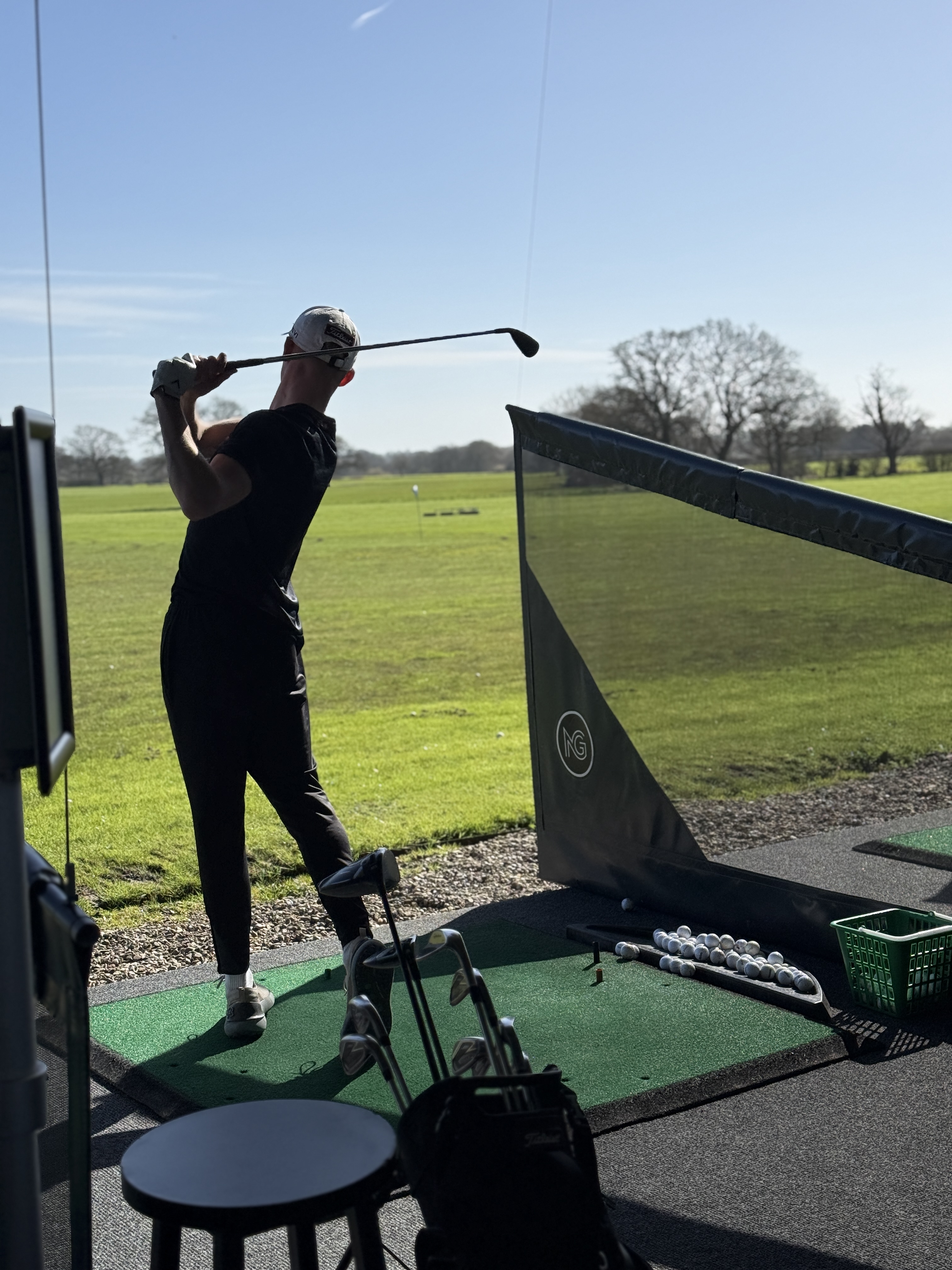 A golfer swinging their club