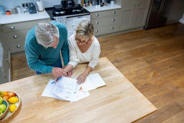 Man and woman checking their bank statements