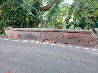 falling wall at side of bridge