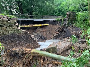 Collapsed road at Wards End Bridge in Poynton, July 2019