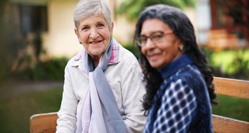 image of two elderly women on a bench 