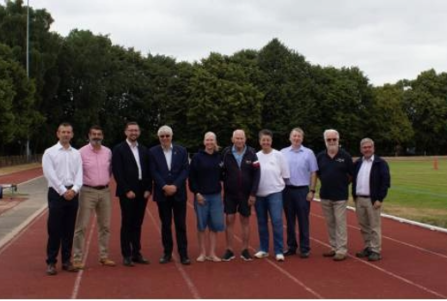announcement event, dignitaries standing on the running track
