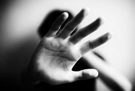 Hands trying to stop domestic abuse