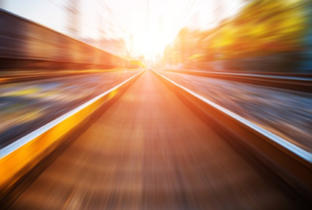 Rail tracks heading towards sunset