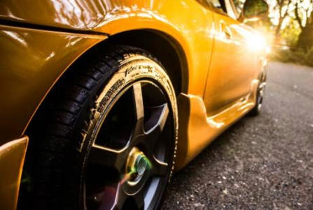 A close-up of a yellow sports car