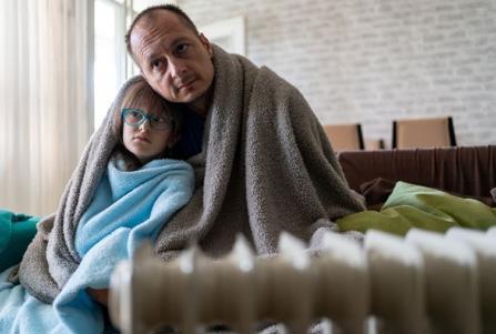 Father and daughter in a cold house