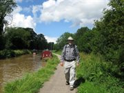 Walker on canal towpath