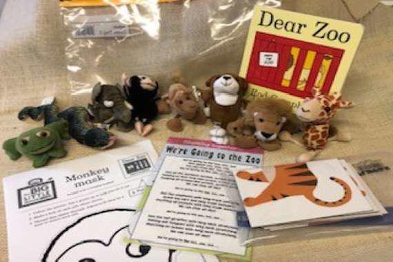 picture of the book with the props for the story 