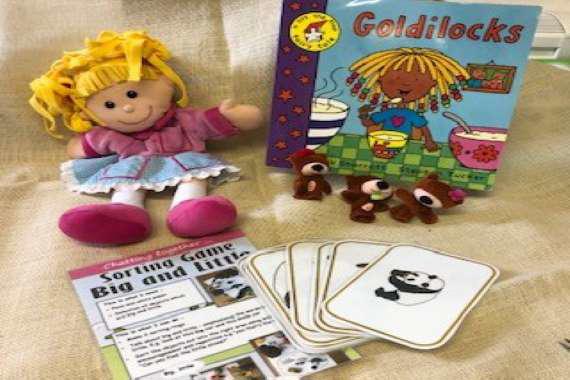 picture of the book with the props for the story