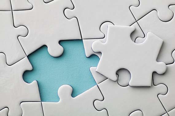 A jigsaw puzzle with one piece removed