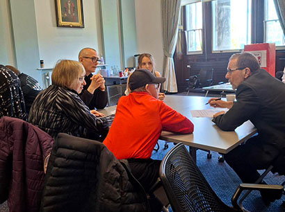 Board members and attendees at the Self-Advocates and Carers meeting 23rd April 2026 sitting around a table
