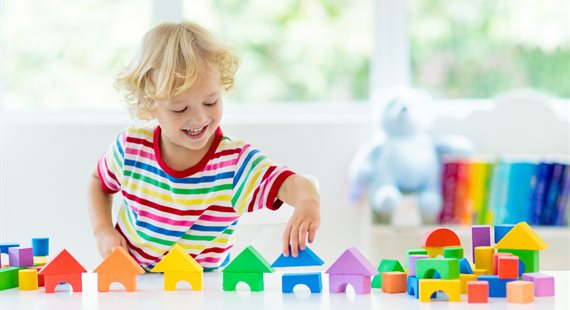 child with building blocks