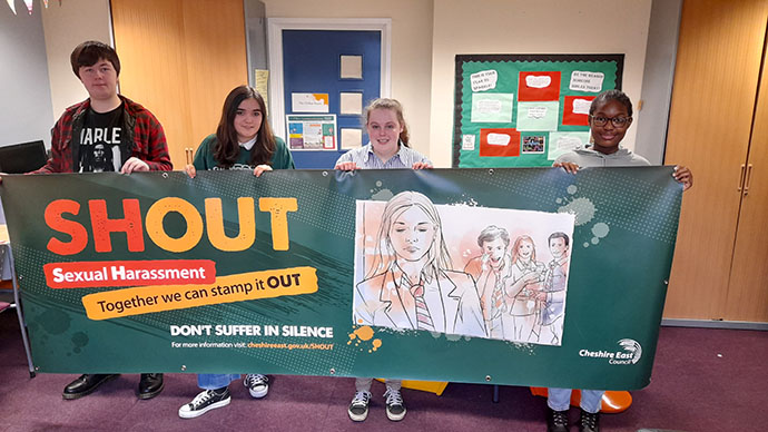 Youth Council school children holding up a banner for SHOUT