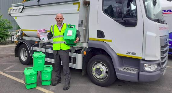 Councillor David Jefferay, Cheshire East Council cabinet member for environment, sustainability and waste management, with the new outdoor food waste caddies and the leaflets and stickers that will be delivered with them to residents.