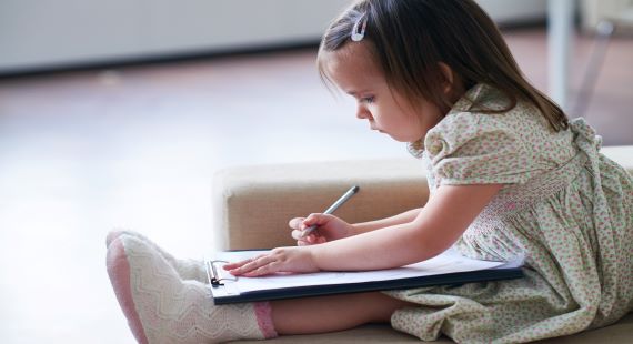 Child with clipboard 570x310