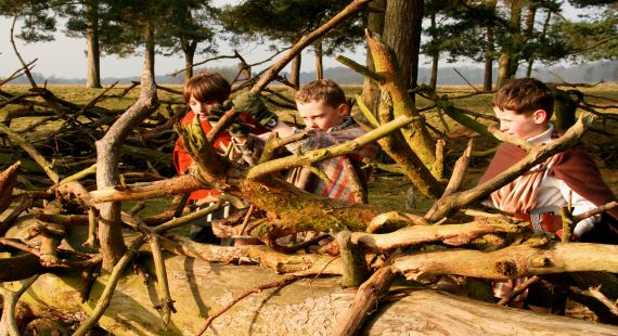 Children building a Viking shelter