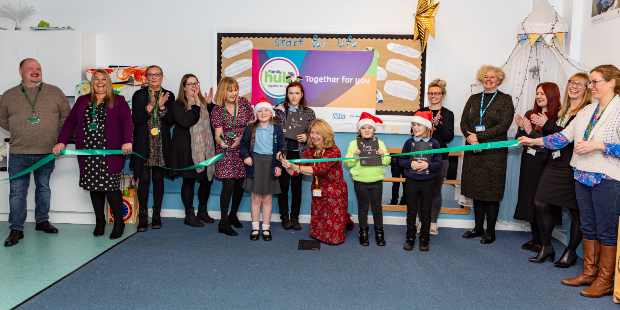 Children from Daven Primary School help to cut the ribbon at the opening of Congleton family hub