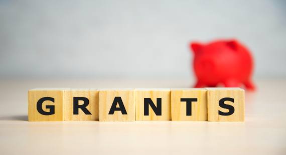 The word grants displayed on wooden blocks