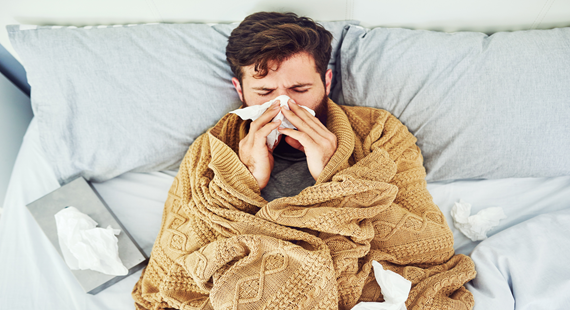 Man in bed with flu 570 x 310