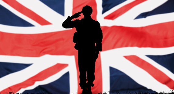 Silhouette of a soldier in front of a British flag