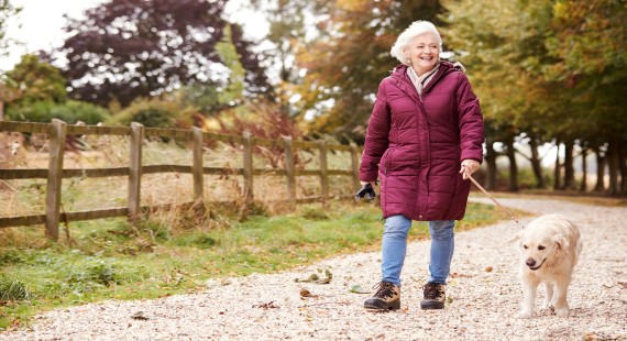 Woman walking dog 570x310