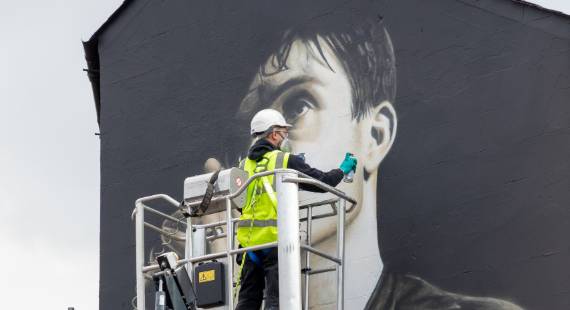 The mural of Ian Curtis adorning a building in Macclesfield, painted by street artist ‘Akse’
